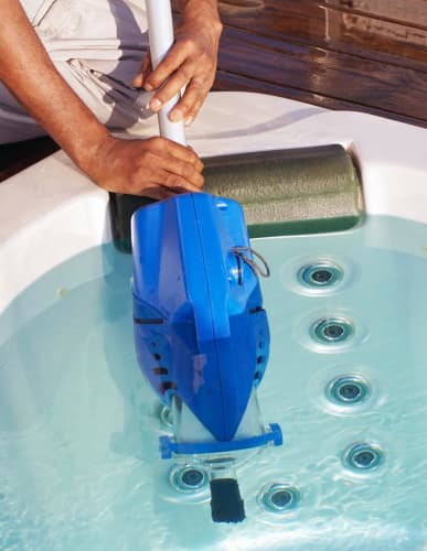 Pool tech cleaning out a hot tub