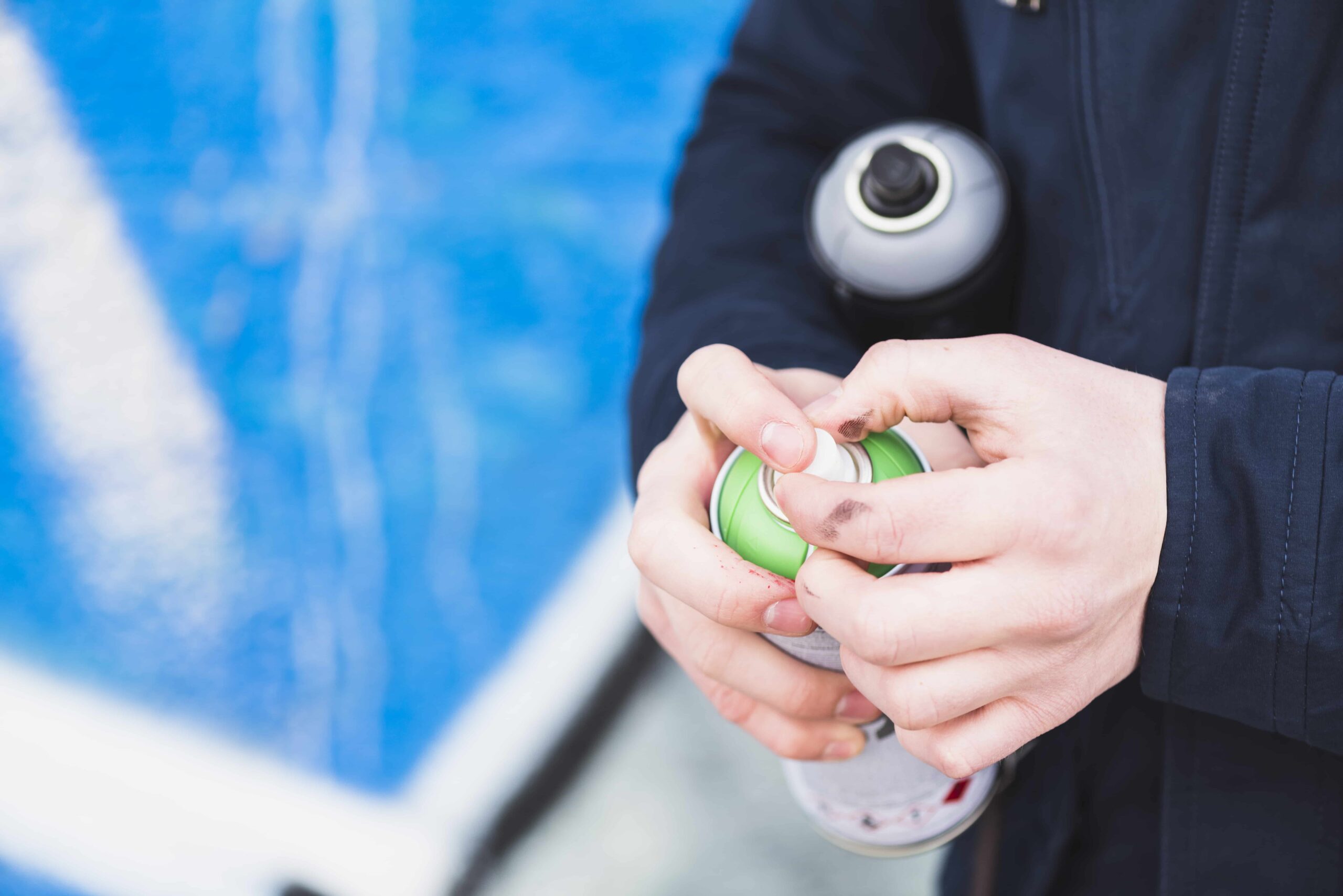 Man holding pool chemicals for pool inspection